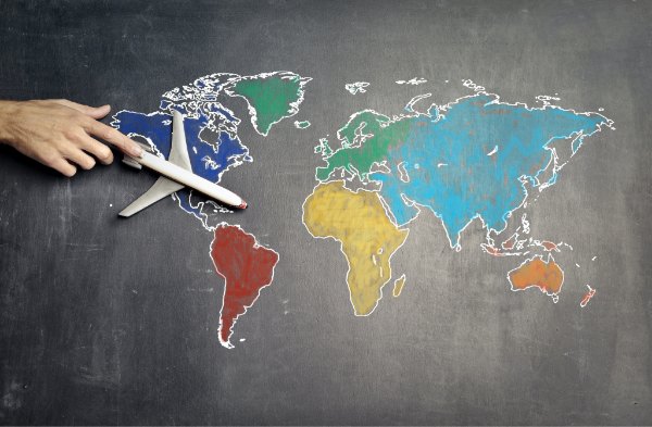 World map with model aeroplane